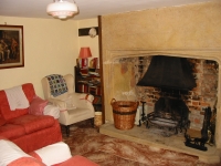 17th century inglenook fireplace, in one of the sitting rooms in Myrtle House